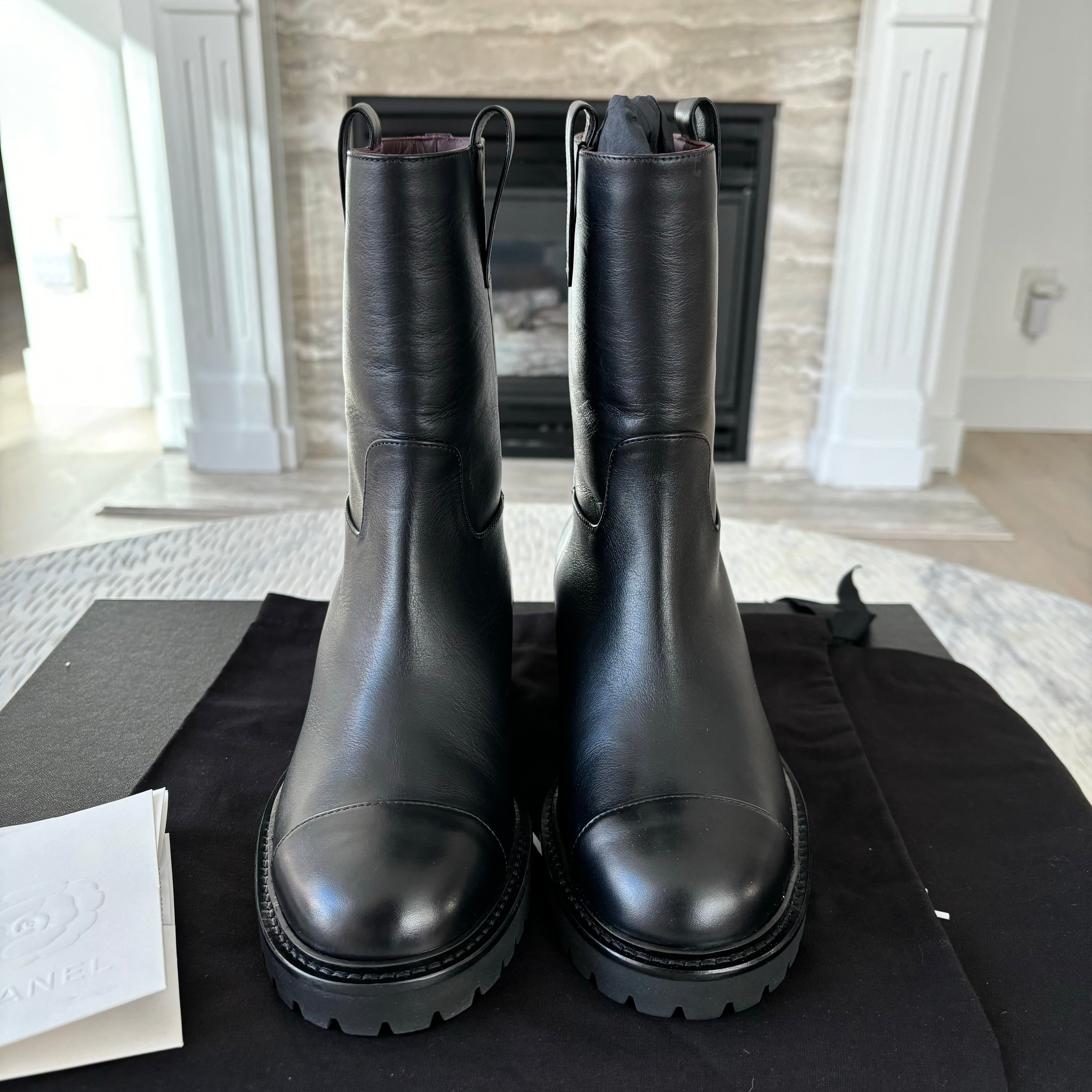 Chanel leather moto boots with CC logo.