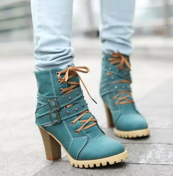 Punk lace-up buckle strap ankle boots for women with block heel and retro belt design.