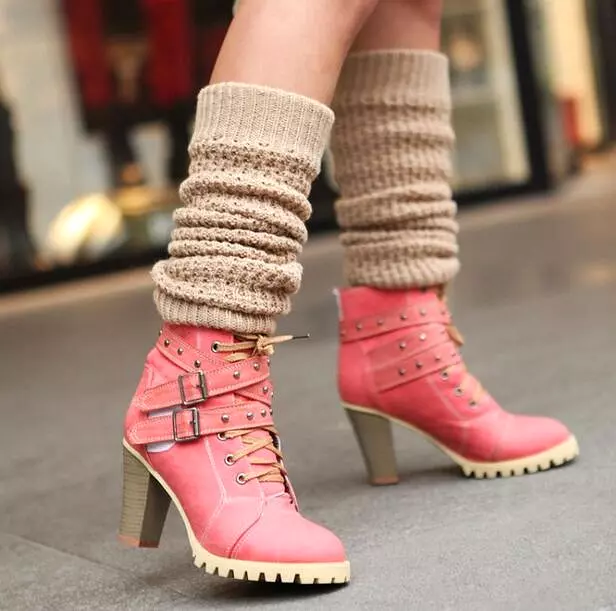 Punk lace-up buckle strap ankle boots for women with block heel and retro belt design.