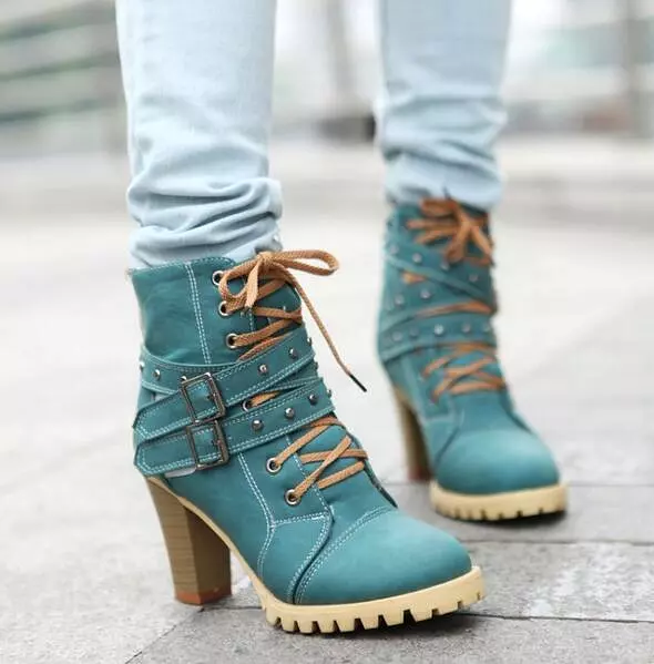 Punk lace-up buckle strap ankle boots for women with block heel and retro belt design.