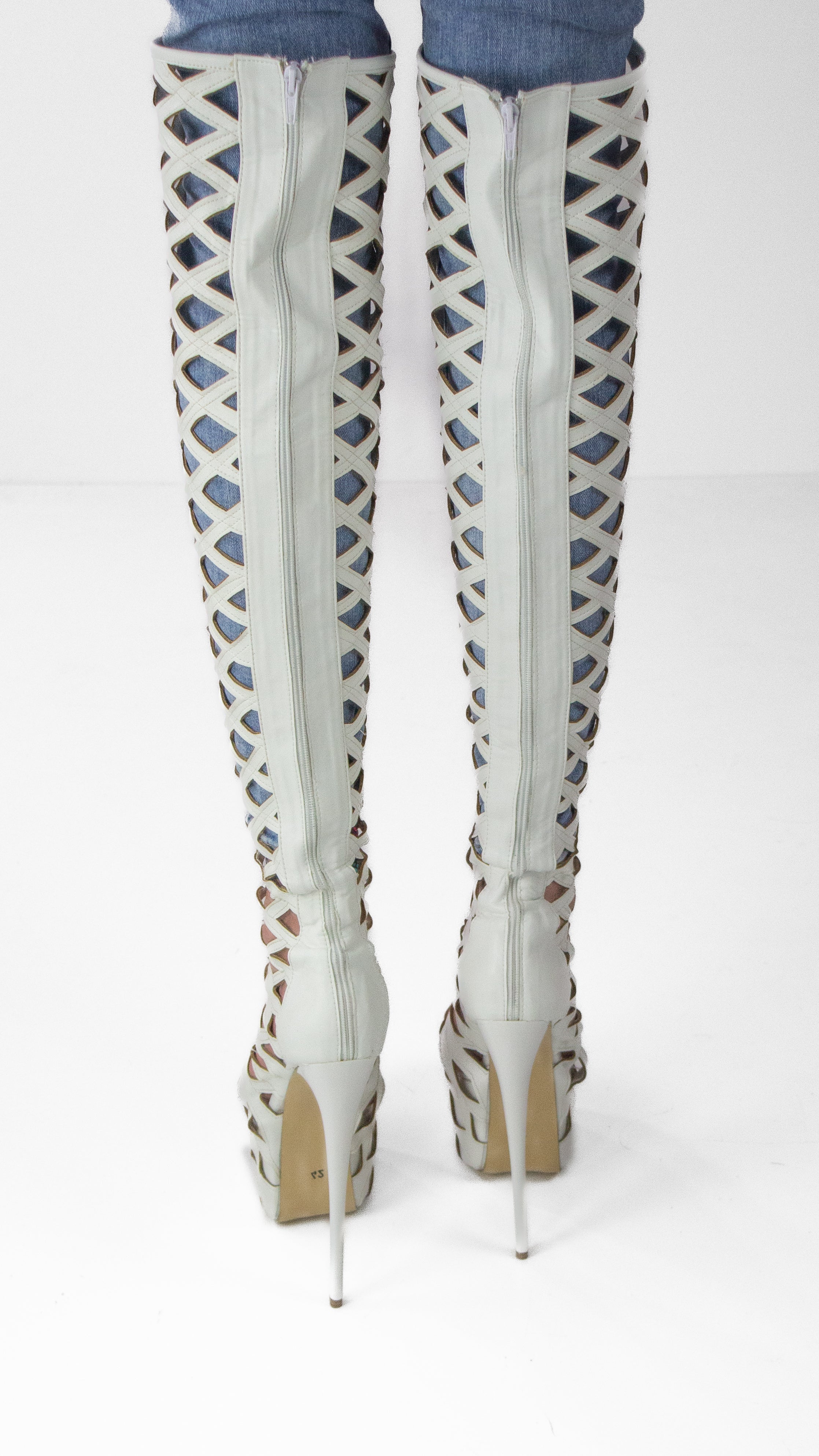 White laser-cut knee-high boots